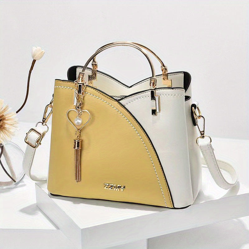 Dames handtas – kleurblok design, kwast details, ruim, stijlvol