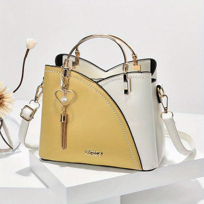 Dames handtas – kleurblok design, kwast details, ruim, stijlvol