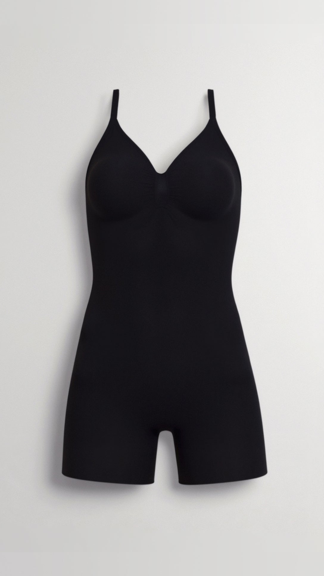 Chique bodysuit tot halverwege de dij met een strakke, figuurvriendelijke pasvorm