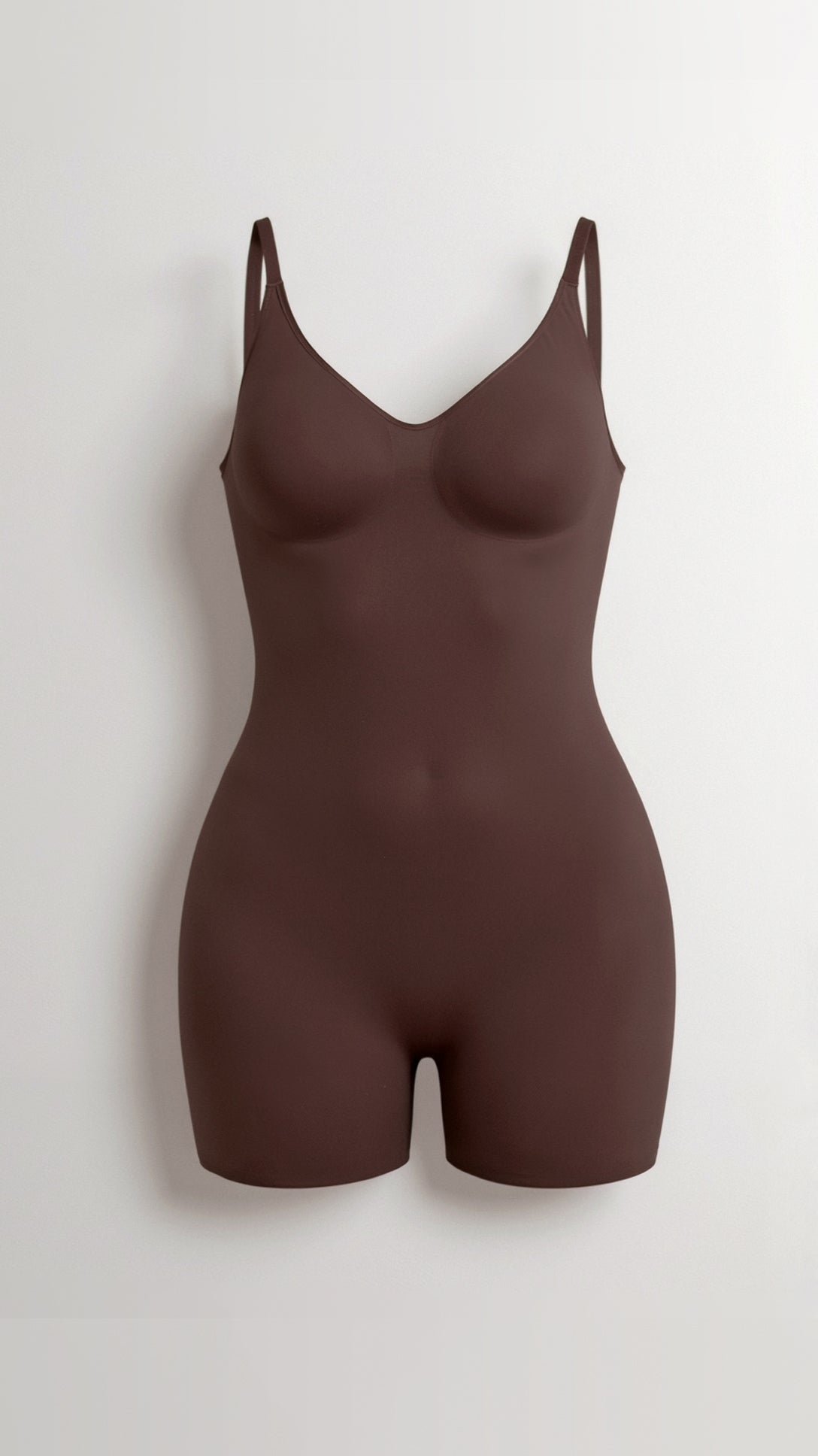 Chique bodysuit tot halverwege de dij met een strakke, figuurvriendelijke pasvorm